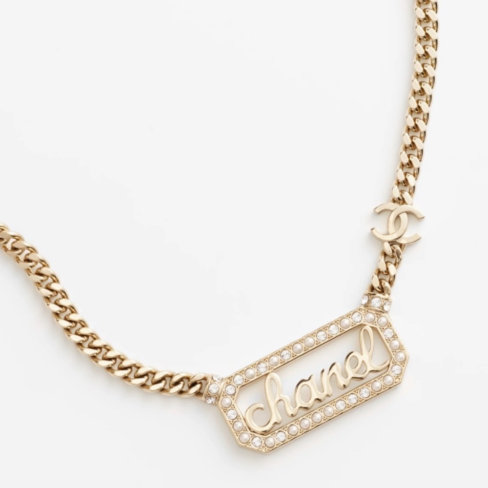 Chanel 2024 metal crystal pearl logo necklace
